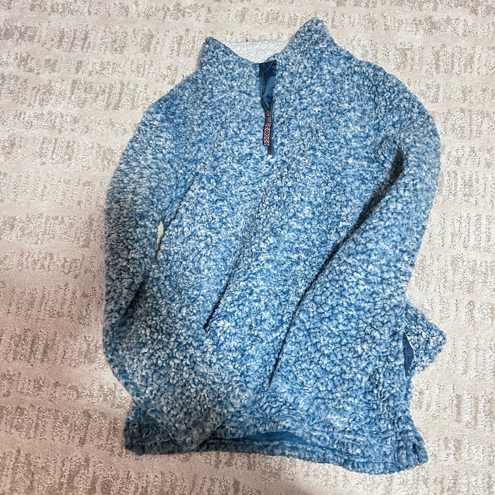 Very fluffy pink and blue sweaters